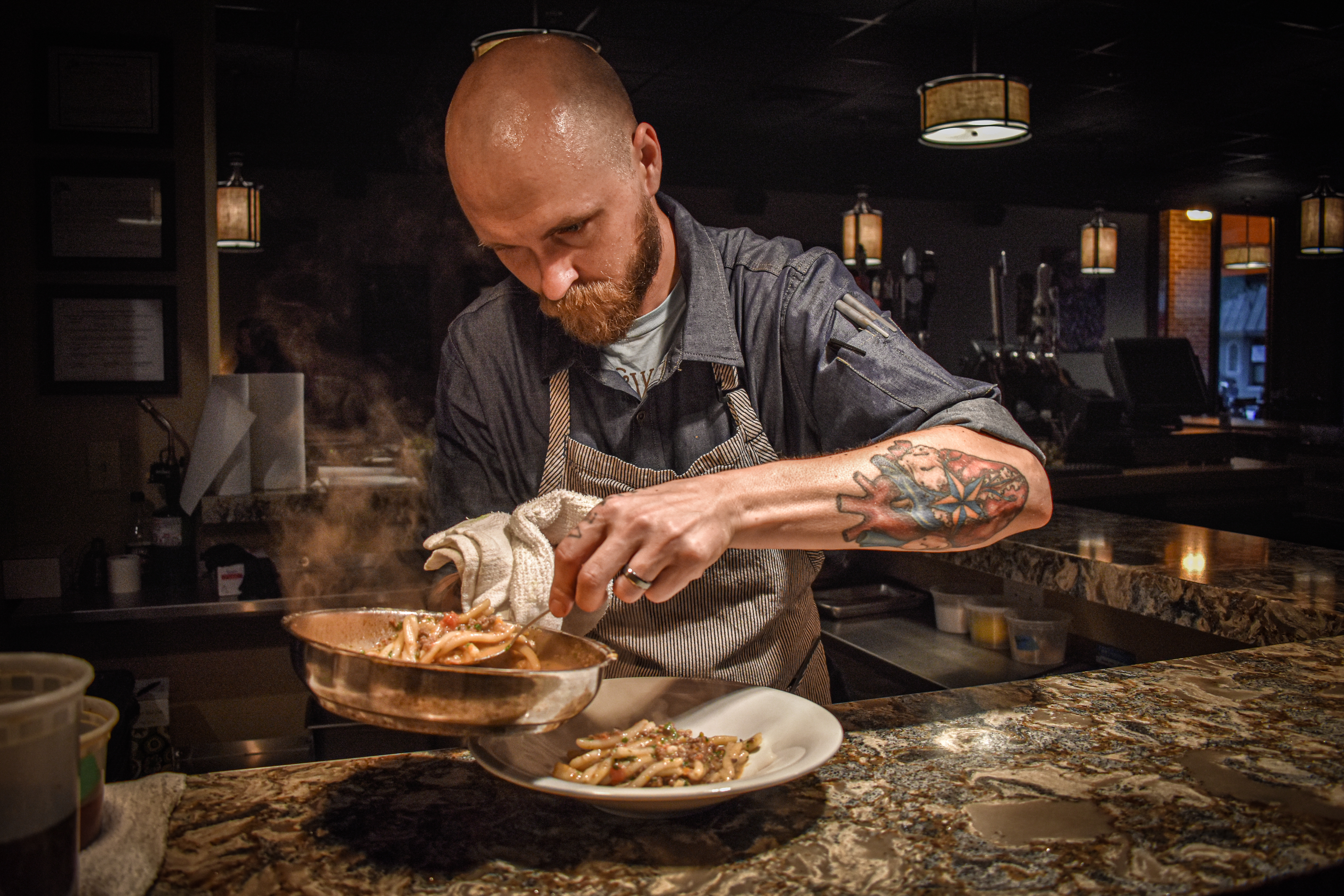 Image of Chef finishing a plate